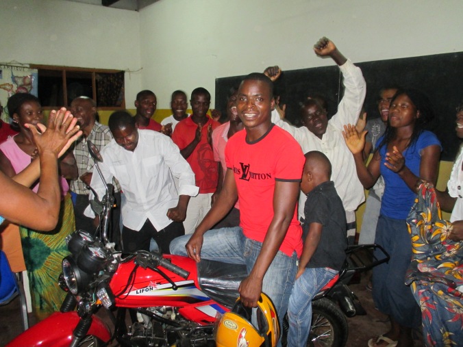 On the final night Jemusse, leader of evangelism received a motor cycle from friends in Mississippi who have joined with us in a tremendous project of giving wheels to leaders who cover long distances to spread the gospel and visit churches. Such excitement and rejoicing from the rest of the group to see Jemusse blessed in this way. They carried on dancing, shouting praise to God, picking him up and carrying him around forever. Great fun! Together with this project we are giving bibles to our various churches scattered across the nation. blankets and cloth wraps for women who have lost their homes due to the present unrest. Many people have had their homes burnt, crops burned in a ‘scorched earth’ policy to try and break the support for the rebels. Tragic to know so many have/are being raped, beaten and killed.