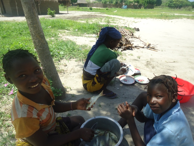 In the meantime the young girls are preparing lunch. They serve with smiles and laughter. People start arriving at the church for week-end meetings.